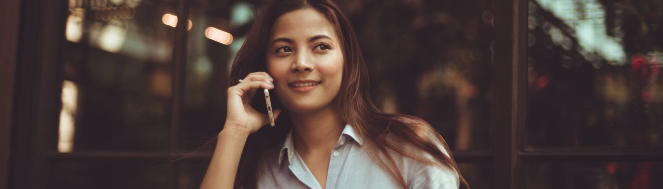 Young woman talking on her cell phone.